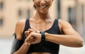 Fitness Tracker. Unrecognizable Athlete Lady Looking At Smartwatch, Checking Sport Activity