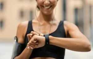 Fitness Tracker. Unrecognizable Athlete Lady Looking At Smartwatch, Checking Sport Activity