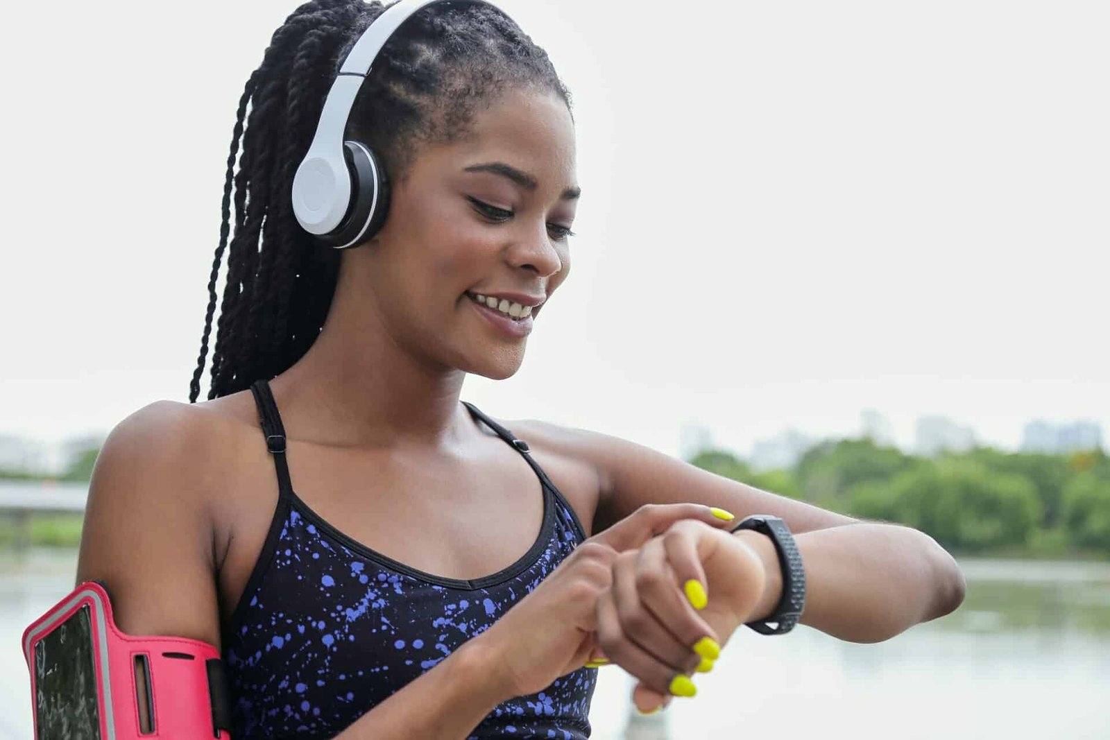 Sportswoman checking fitness tracker